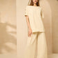 Cheesecloth trouser set with gold button shoulders in Beige